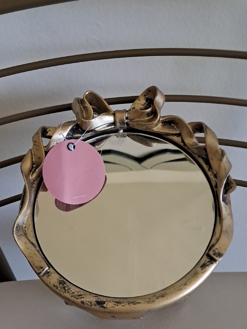 Antique-Style Bow Accent Tabletop Mirror in Gold Finish
